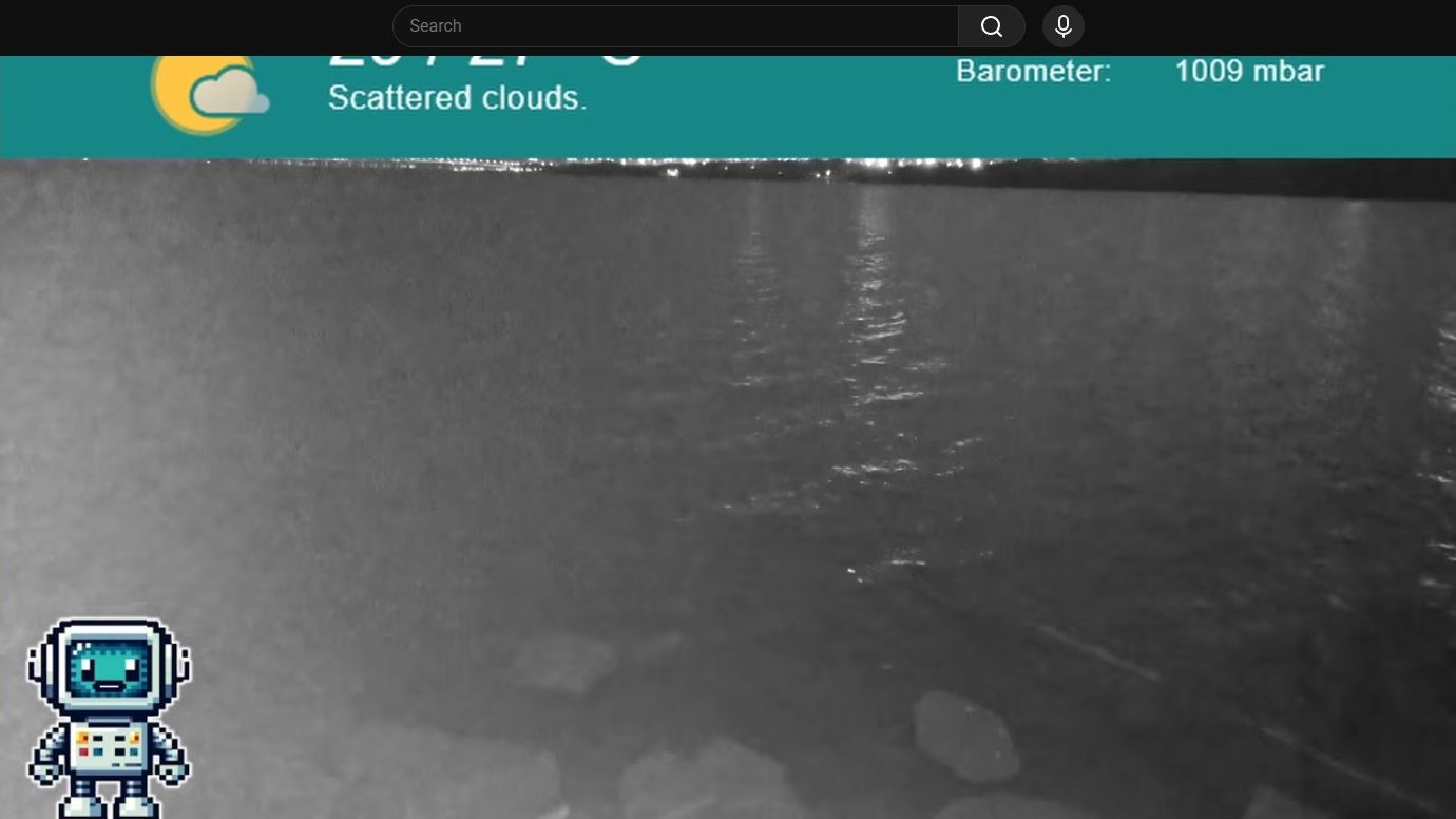 Nighttime coastal view with weather overlay showing barometer at 1009 mbar