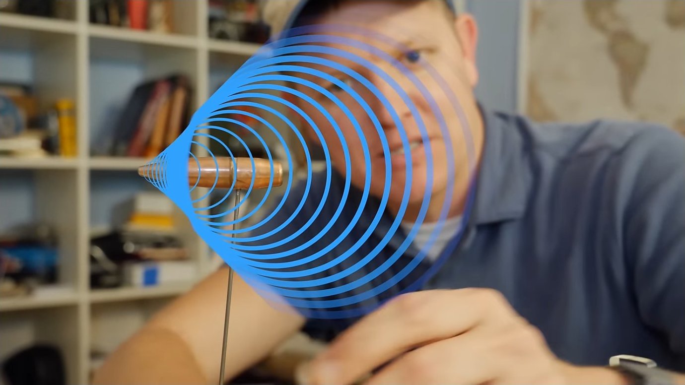 A Schlieren visualization illustrating the concentric circular pressure waves radiating from a supersonic source, showing how sound wavefronts accumulate into a coherent shock.