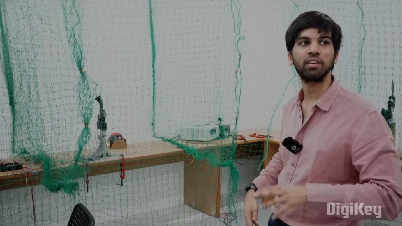 An indoor testing facility with netting for safe flight evaluation. Controlled environments allow engineers to test aircraft behavior in repeatable conditions, gather performance data, and validate firmware updates before field deployment.