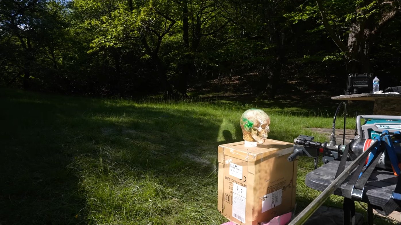 Test range setup showing the mounting table, ballistic targets, and high-speed camera placement for documenting terminal effects at various standoff distances.