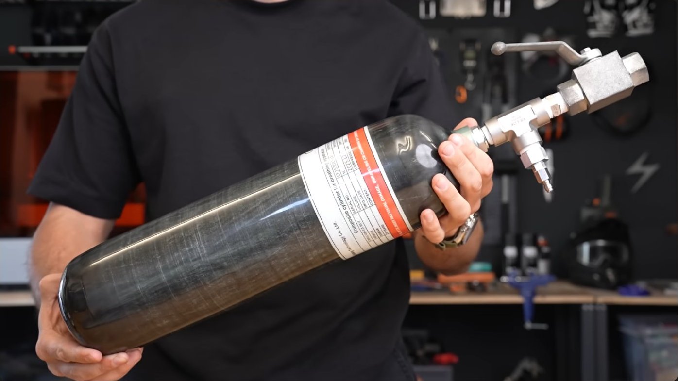A carbon fiber wrapped aluminum tank rated for 4,500 PSI and 3 liters of atmospheric volume — capable of storing 918 liters of compressed air at maximum pressure, representing 135 times the volume of a single paintball cartridge.