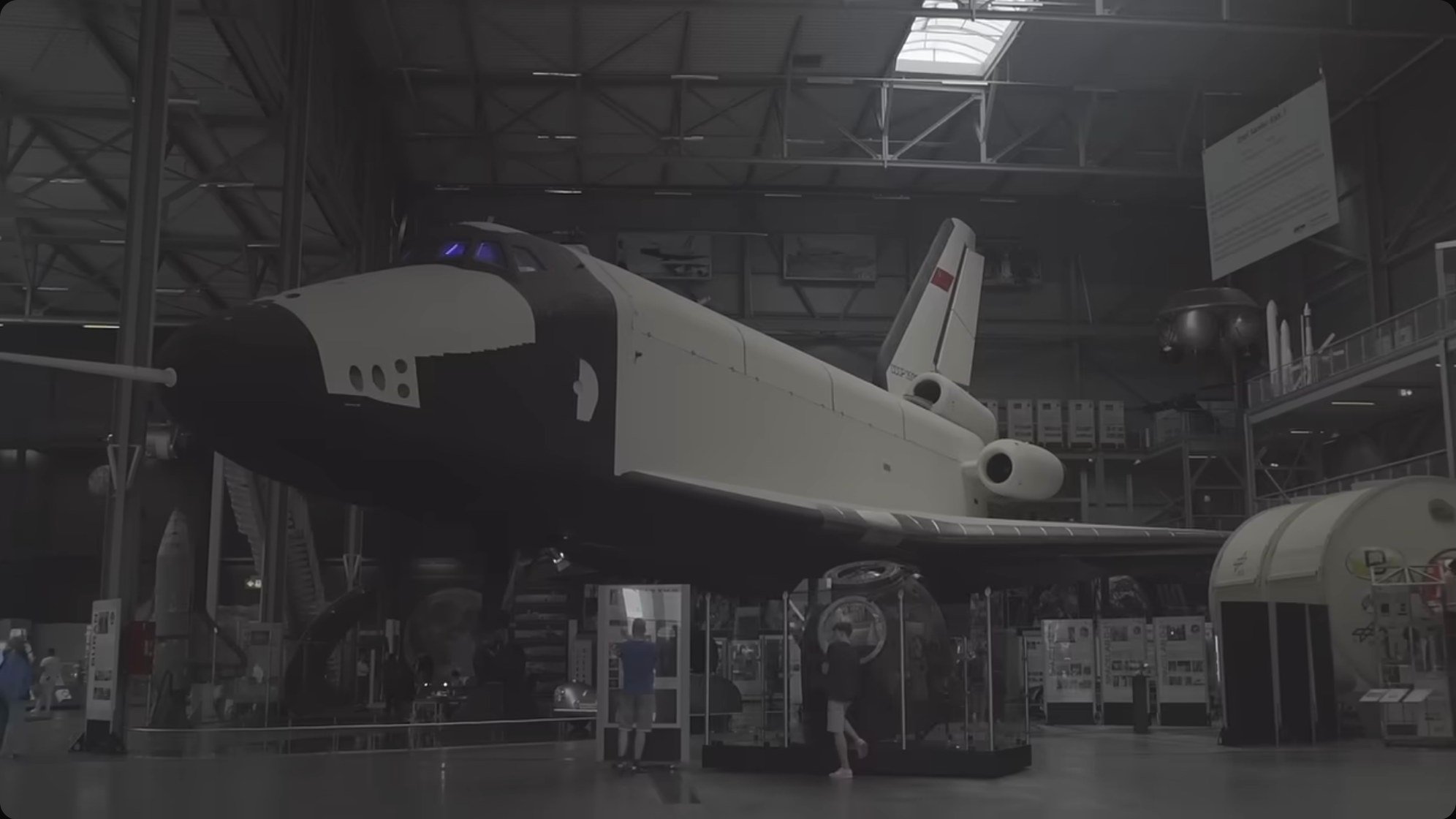 A full-scale Buran orbiter on display in a museum hangar. The vehicle's airframe closely resembles the Space Shuttle, but the systems within were fundamentally different.
