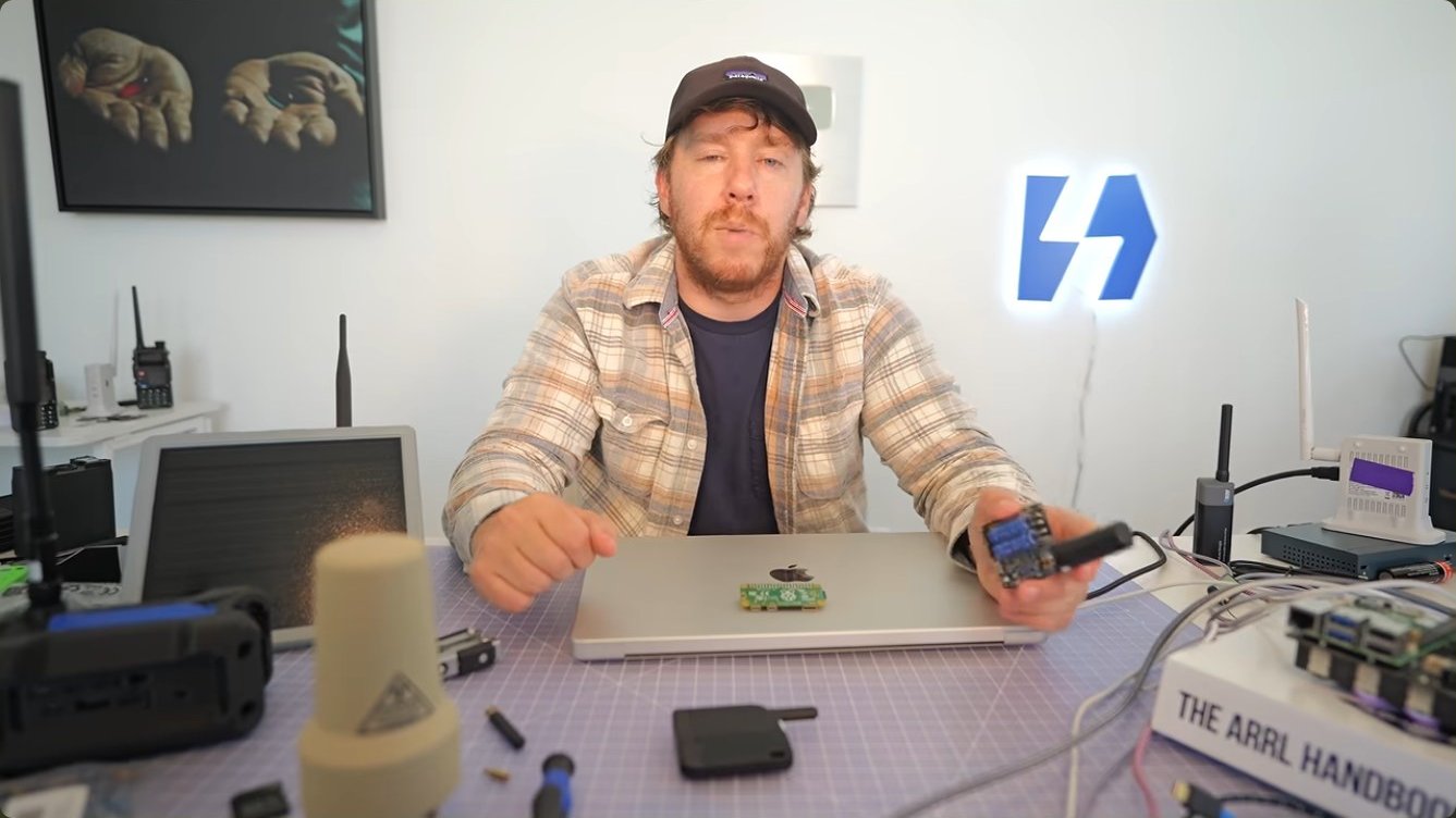 The full kit laid out: a satellite modem, a Raspberry Pi Zero, and antennas.