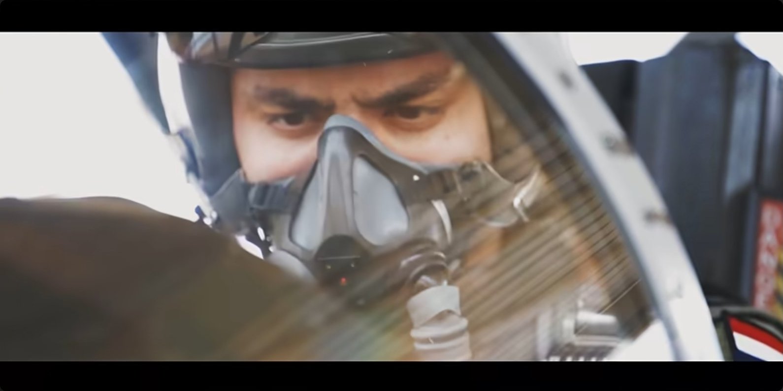 A student in oxygen mask and helmet during a high-workload sortie.