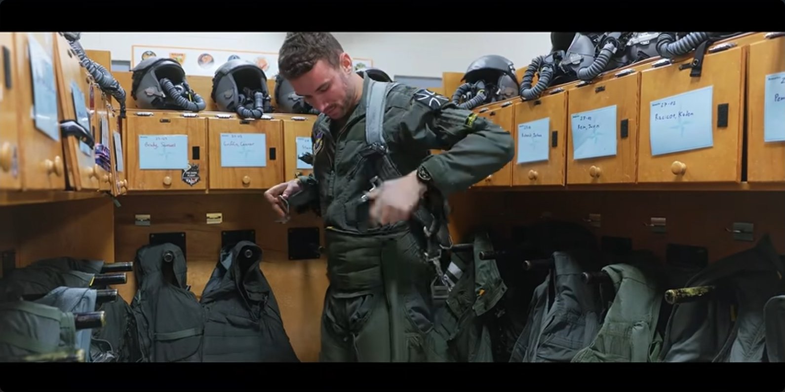 Suiting up in the life-support room before a sortie.